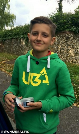 A school boy has cut his hair for the first time in his life to raise money for charity and make wigs for cancer victims. See MASONS story MNHAIR. Rahim Woods has raised more than Ã1,500 after deciding to shed his 3ft head of hair which reached his knees. As he is starting secondary school in September he and his family decided it was time for a change - but they knew they would have to do something special. After discussing what to do with his parents and siblings Rahim decided he would lop off his locks to raise money for the The Thomas Ball ChildrenÃs Cancer Fund. The initial target was set at Ã500 on his Just Giving page but within three days donations had come pouring in and he has now raised Ã1565. Friends and family attended the event at The Eden Centre shopping centre in High Wycombe where Rahim took to the chair to face the scissors.